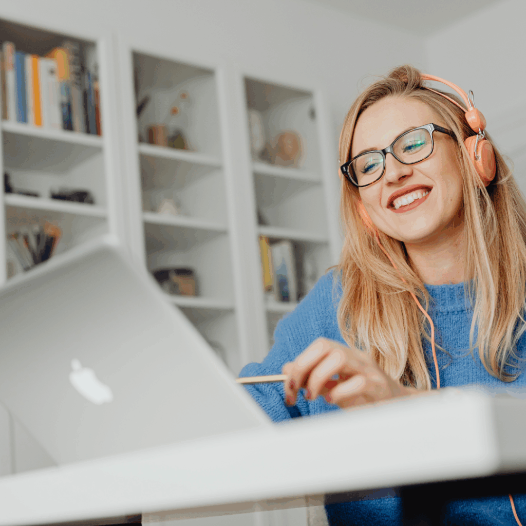 Student attending an online lesson with EdEx Online using laptop and headphones