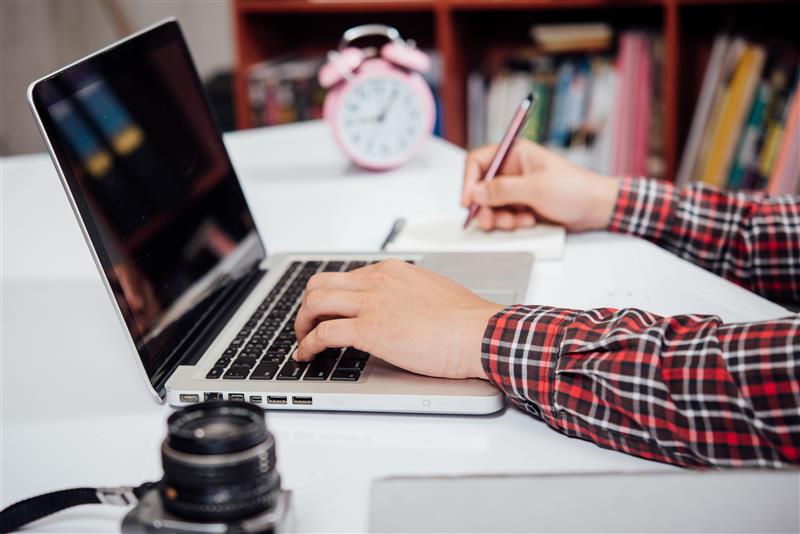 distance learning UK students using laptop